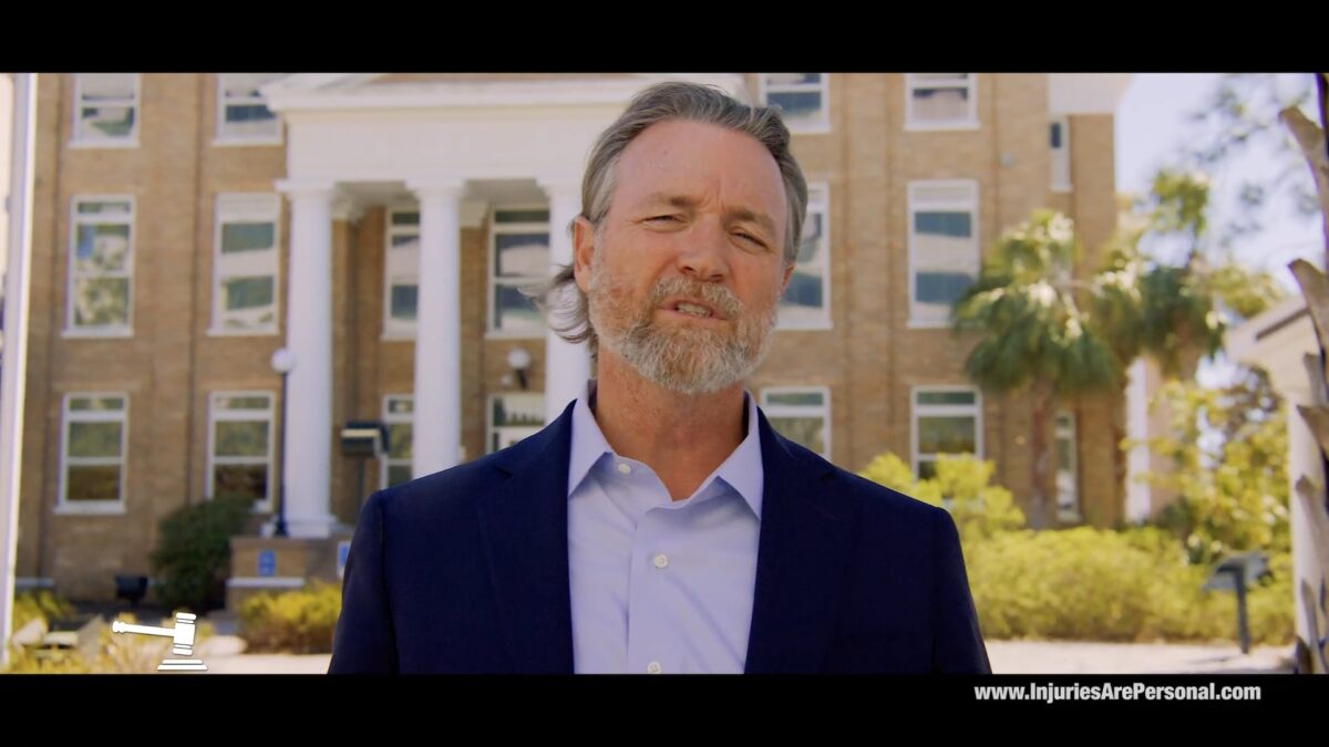 A man in front of an office