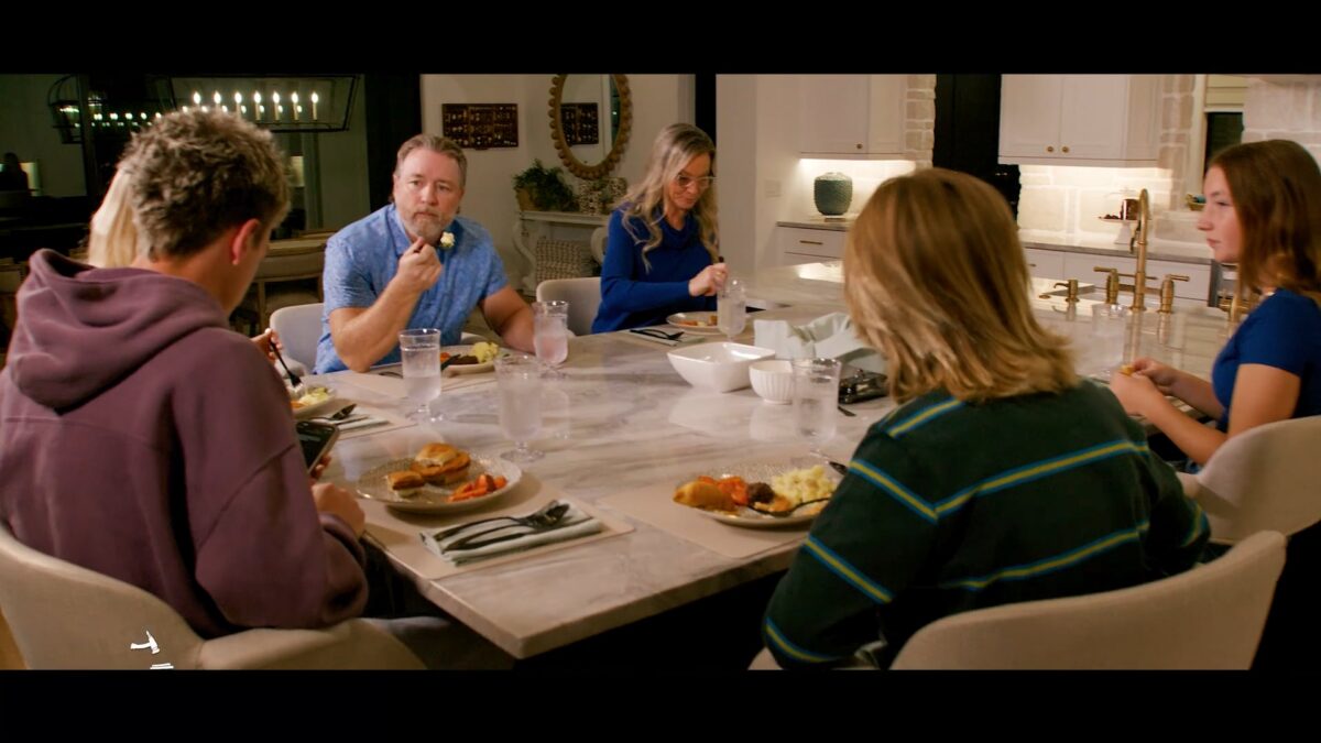 People sitting down eating a meal