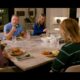 People sitting down eating a meal