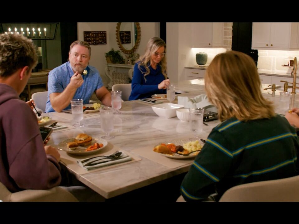 People sitting down eating a meal