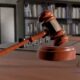 A judge hammer on the desk